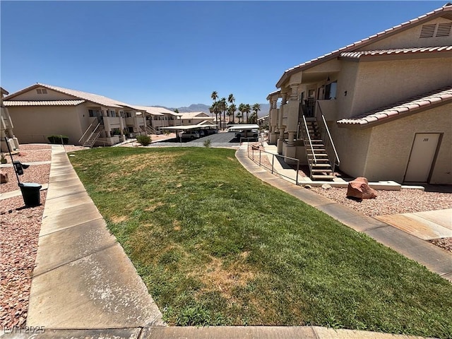 435 Mesa Blvd Unit 202, Mesquite, NV 89027 - view of green lawn featuring stairs and a residential view