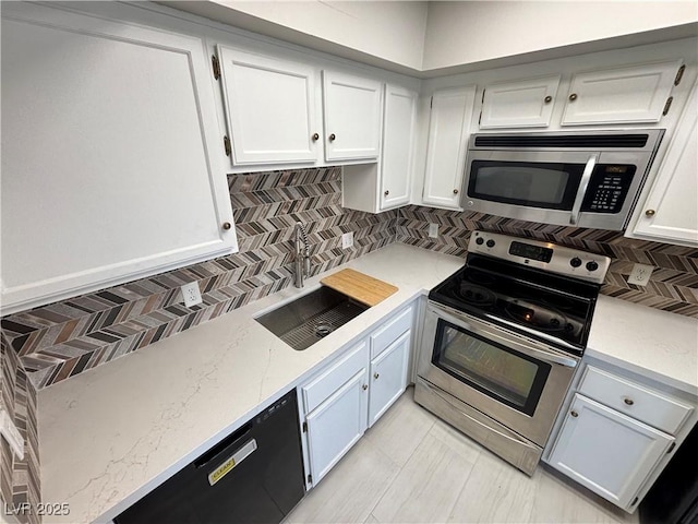 435 Mesa Blvd Unit 202, Mesquite, NV 89027 - kitchen featuring stainless steel appliances, backsplash, white cabinets, and light stone countertops