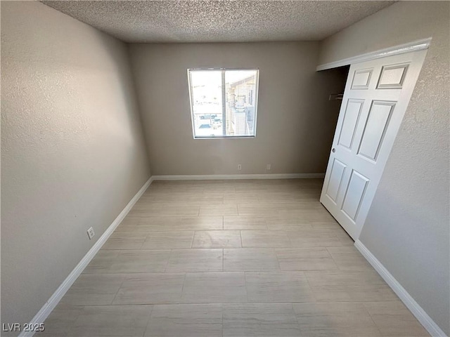 435 Mesa Blvd Unit 202, Mesquite, NV 89027 - unfurnished bedroom featuring a textured ceiling and baseboards
