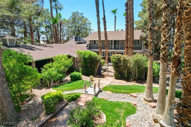 5260 N Jones Blvd, Las Vegas, NV 89130 - view of front of home with a gate, roof with shingles, and a balcony