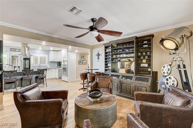5260 N Jones Blvd, Las Vegas, NV 89130 - living area featuring a ceiling fan, crown molding, and light wood-style floors
