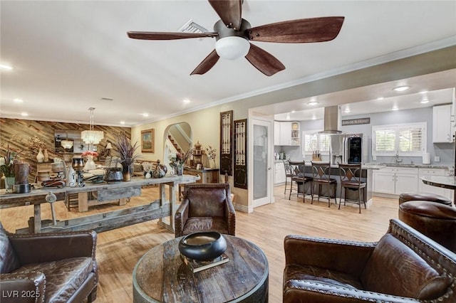 5260 N Jones Blvd, Las Vegas, NV 89130 - living room with crown molding, light wood-style floors, ceiling fan, recessed lighting, and arched walkways