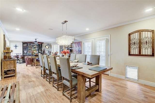 5260 N Jones Blvd, Las Vegas, NV 89130 - dining room with crown molding, ceiling fan, light wood-style floors, a fireplace, and plenty of natural light
