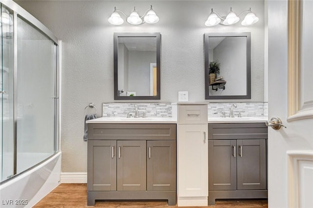 5260 N Jones Blvd, Las Vegas, NV 89130 - full bathroom featuring decorative backsplash, two vanities, and wood finished floors