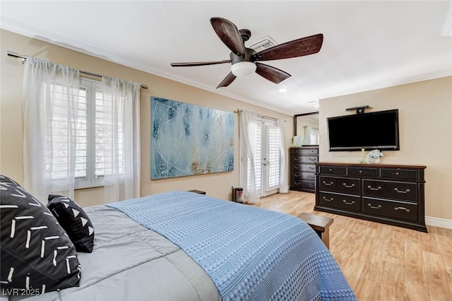 5260 N Jones Blvd, Las Vegas, NV 89130 - bedroom with ornamental molding, light wood-style floors, a ceiling fan, and access to exterior