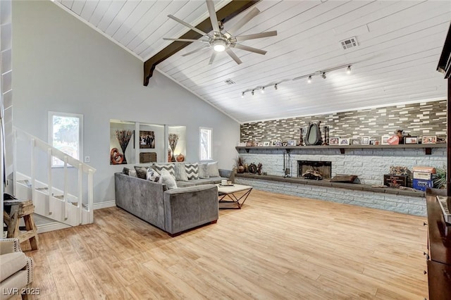 5260 N Jones Blvd, Las Vegas, NV 89130 - living room with wood finished floors, ceiling fan, stairway, wooden ceiling, and a fireplace