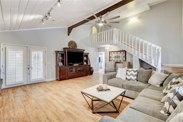 5260 N Jones Blvd, Las Vegas, NV 89130 - living room featuring stairs, ceiling fan, light wood-style flooring, rail lighting, and french doors