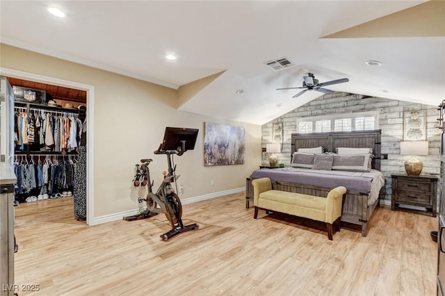 5260 N Jones Blvd, Las Vegas, NV 89130 - bedroom with light wood-style floors, lofted ceiling, a spacious closet, a ceiling fan, and recessed lighting