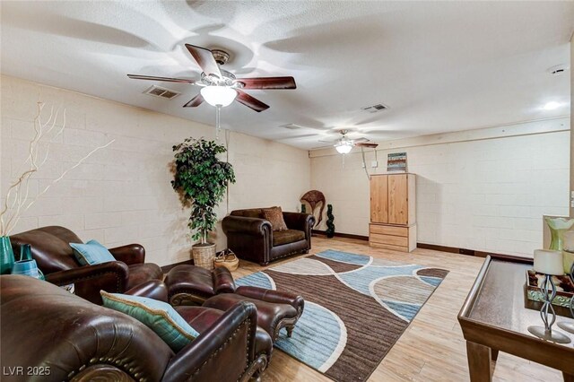5260 N Jones Blvd, Las Vegas, NV 89130 - living area with a ceiling fan, wood finished floors, and concrete block wall