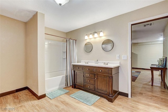 5260 N Jones Blvd, Las Vegas, NV 89130 - bathroom with wood finished floors, shower / bath combination with curtain, and double vanity