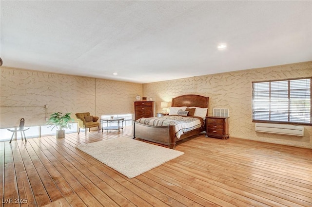 5260 N Jones Blvd, Las Vegas, NV 89130 - bedroom with wood-type flooring, an AC wall unit, and recessed lighting