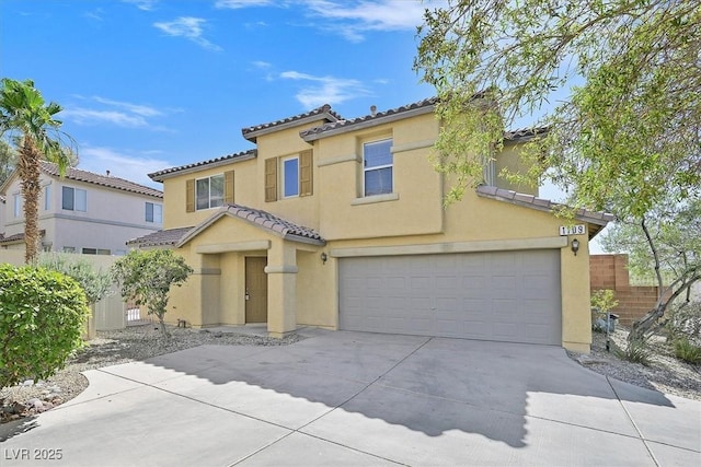 1109 Claire Rose Ave, Las Vegas, NV 89183 - mediterranean / spanish home with an attached garage, stucco siding, concrete driveway, and a tile roof