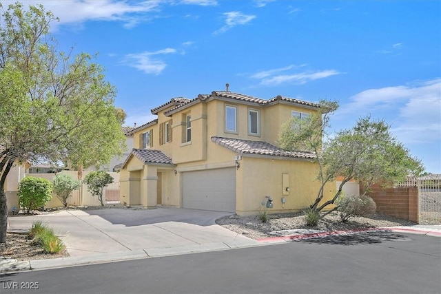 1109 Claire Rose Ave, Las Vegas, NV 89183 - mediterranean / spanish house with an attached garage, concrete driveway, stucco siding, and a tiled roof