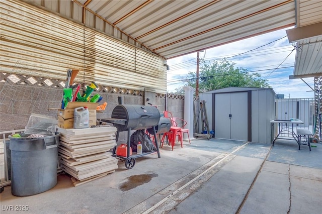 224 Catalini St, Las Vegas, NV 89107 - fenced backyard with a patio area, a storage unit, and a grill