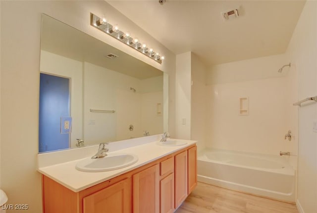 23 E Agate Ave Unit 207, Las Vegas, NV 89123 - full bath with wood finished floors, double vanity, and tub / shower combination