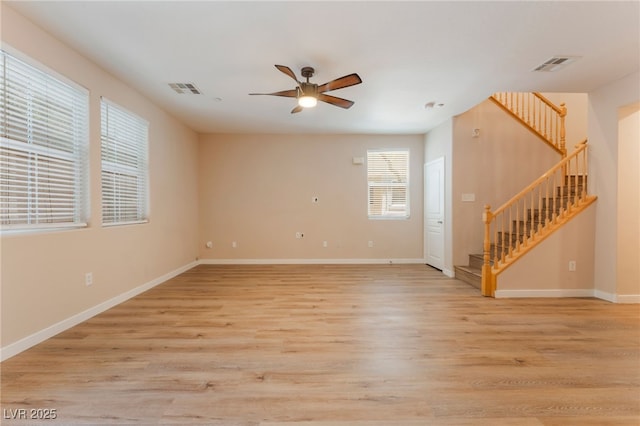 455 Westminster Hall Ave Unit 101, North Las Vegas, NV 89032 - unfurnished room with stairs, a ceiling fan, and light wood-style floors