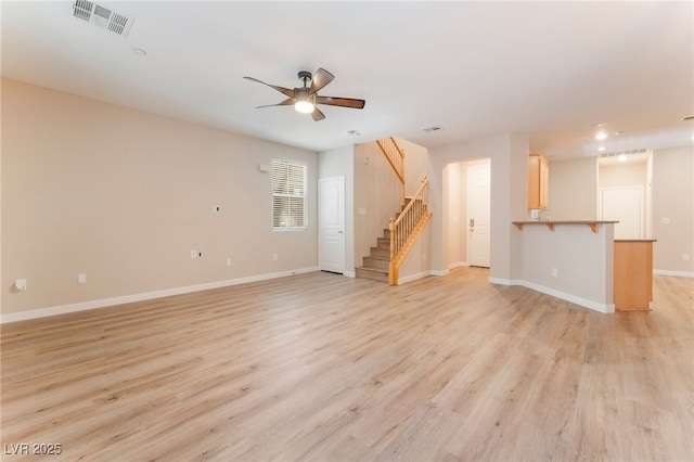 455 Westminster Hall Ave Unit 101, North Las Vegas, NV 89032 - unfurnished living room with stairs, ceiling fan, light wood-type flooring, and recessed lighting
