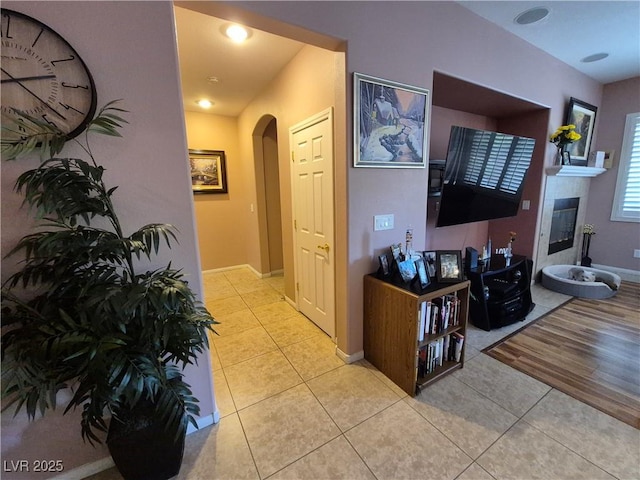 6009 Arbor Crest St, North Las Vegas, NV 89081 - hall featuring arched walkways and tile patterned flooring
