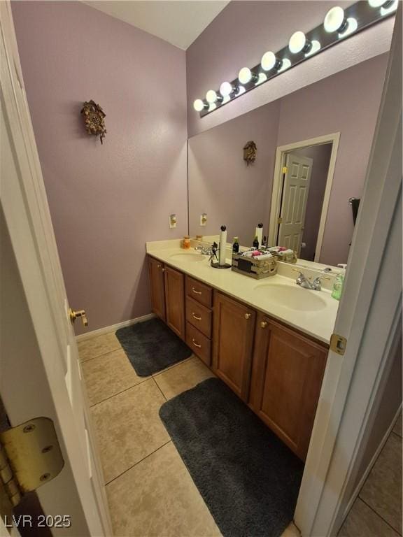 6009 Arbor Crest St, North Las Vegas, NV 89081 - bathroom featuring double vanity and tile patterned flooring
