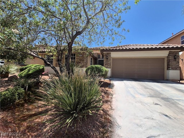 6009 Arbor Crest St, North Las Vegas, NV 89081 - single story home with stone siding, concrete driveway, a garage, and a tiled roof