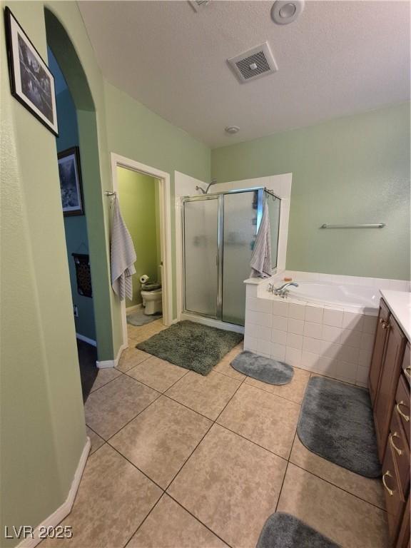 6009 Arbor Crest St, North Las Vegas, NV 89081 - full bath with a shower stall, vanity, a garden tub, and tile patterned flooring