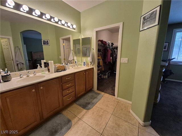 6009 Arbor Crest St, North Las Vegas, NV 89081 - full bath with double vanity, a spacious closet, and tile patterned floors