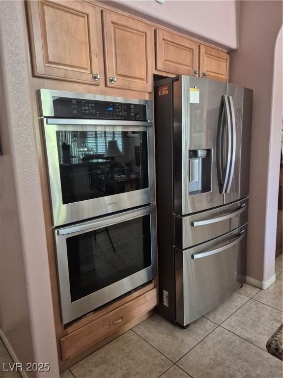 6009 Arbor Crest St, North Las Vegas, NV 89081 - kitchen featuring stainless steel appliances and light tile patterned floors