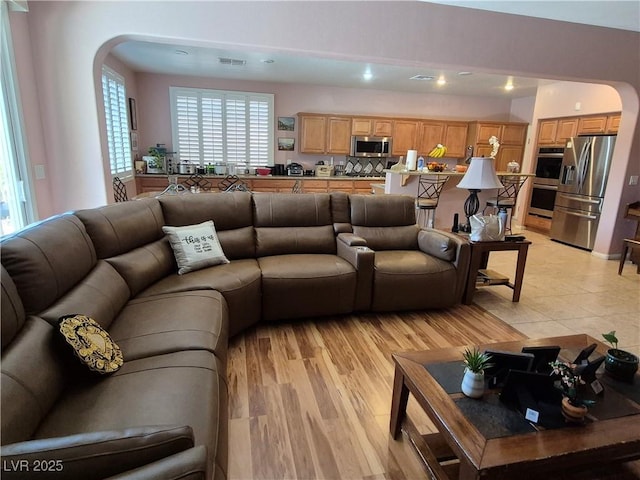 6009 Arbor Crest St, North Las Vegas, NV 89081 - living area featuring arched walkways and recessed lighting
