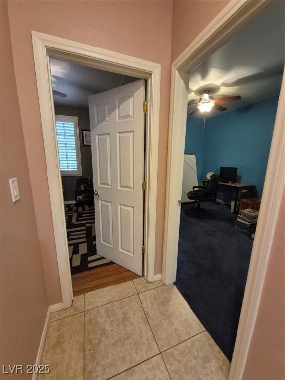 6009 Arbor Crest St, North Las Vegas, NV 89081 - corridor featuring a desk, tile patterned floors, and carpet