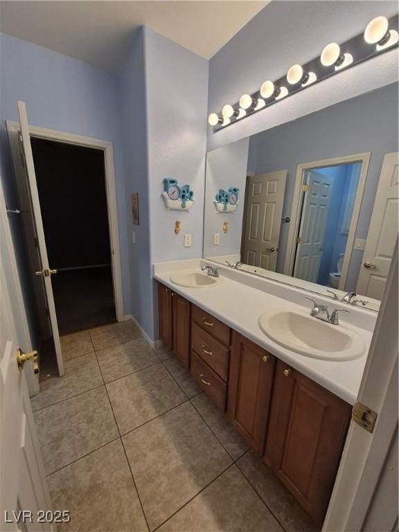 6009 Arbor Crest St, North Las Vegas, NV 89081 - bathroom with double vanity and tile patterned flooring