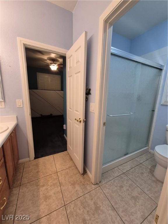 6009 Arbor Crest St, North Las Vegas, NV 89081 - ensuite bathroom with vanity, a shower stall, tile patterned flooring, and a ceiling fan
