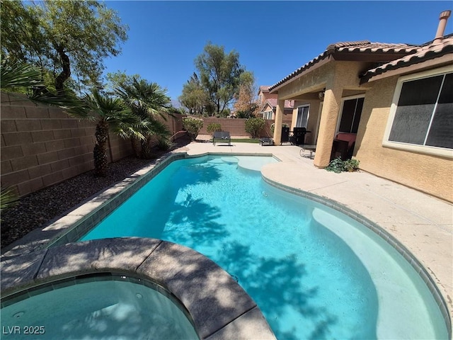 6009 Arbor Crest St, North Las Vegas, NV 89081 - view of pool featuring an in-ground hot tub, a fenced backyard, and a patio area