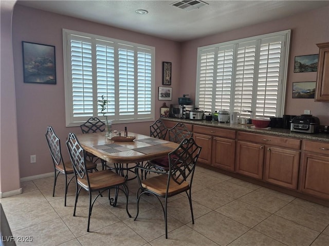 6009 Arbor Crest St, North Las Vegas, NV 89081 - dining space with light tile patterned flooring