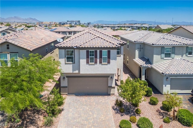 9136 Cocowoods Pl, Las Vegas, NV 89148 - mediterranean / spanish house featuring stucco siding, a residential view, and a tile roof