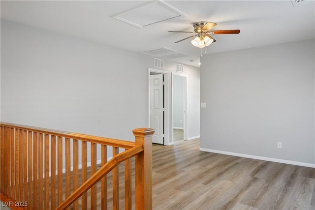 9136 Cocowoods Pl, Las Vegas, NV 89148 - empty room featuring wood finished floors, ceiling fan, and attic access