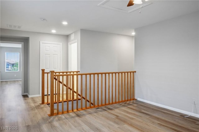 9136 Cocowoods Pl, Las Vegas, NV 89148 - hallway with an upstairs landing, wood finished floors, and recessed lighting