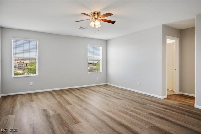 9136 Cocowoods Pl, Las Vegas, NV 89148 - spare room featuring plenty of natural light, ceiling fan, and wood finished floors