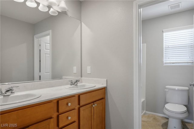 9136 Cocowoods Pl, Las Vegas, NV 89148 - bathroom featuring double vanity and toilet