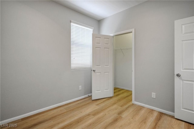 9136 Cocowoods Pl, Las Vegas, NV 89148 - unfurnished bedroom featuring light wood-style flooring and a closet