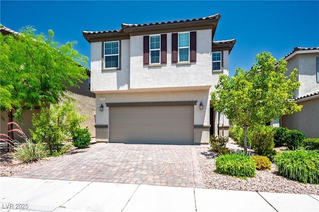 9136 Cocowoods Pl, Las Vegas, NV 89148 - view of front of home featuring stucco siding, an attached garage, driveway, and a tiled roof