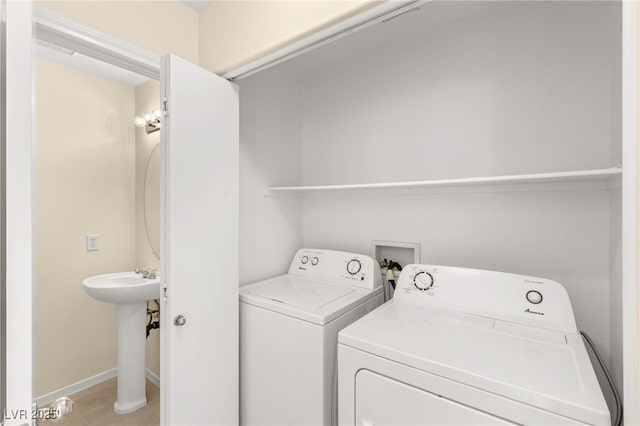 10437 Coyote Cub Ave, Las Vegas, NV 89129 - washroom with independent washer and dryer and baseboards