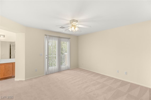 10437 Coyote Cub Ave, Las Vegas, NV 89129 - empty room with light carpet and a ceiling fan