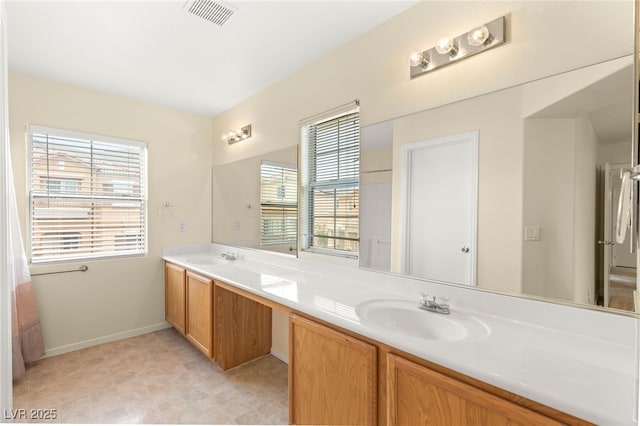 10437 Coyote Cub Ave, Las Vegas, NV 89129 - bathroom with double vanity and healthy amount of natural light