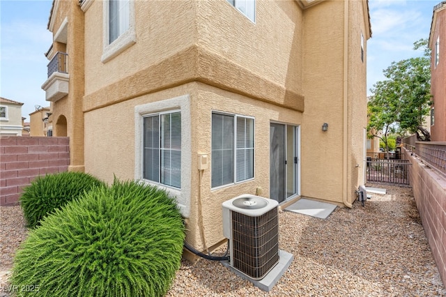 10437 Coyote Cub Ave, Las Vegas, NV 89129 - view of side of home with stucco siding and a fenced backyard