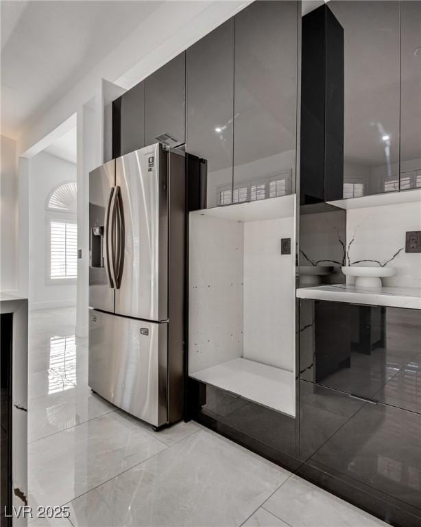 825 Royal Moon Ave, Las Vegas, NV 89123 - kitchen with stainless steel fridge with ice dispenser, modern cabinets, and backsplash
