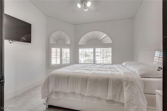 825 Royal Moon Ave, Las Vegas, NV 89123 - bedroom featuring light marble finish flooring, multiple windows, and ceiling fan
