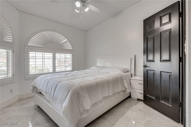825 Royal Moon Ave, Las Vegas, NV 89123 - bedroom featuring light marble finish flooring, lofted ceiling, and ceiling fan