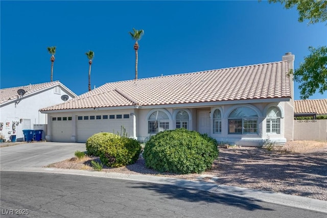 825 Royal Moon Ave, Las Vegas, NV 89123 - mediterranean / spanish home with an attached garage, a tiled roof, driveway, stucco siding, and a chimney