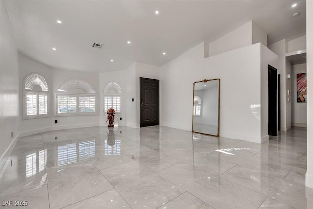825 Royal Moon Ave, Las Vegas, NV 89123 - empty room with a high ceiling, light marble finish floors, and recessed lighting