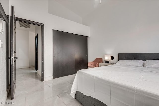 825 Royal Moon Ave, Las Vegas, NV 89123 - bedroom with a closet, light marble finish flooring, and lofted ceiling